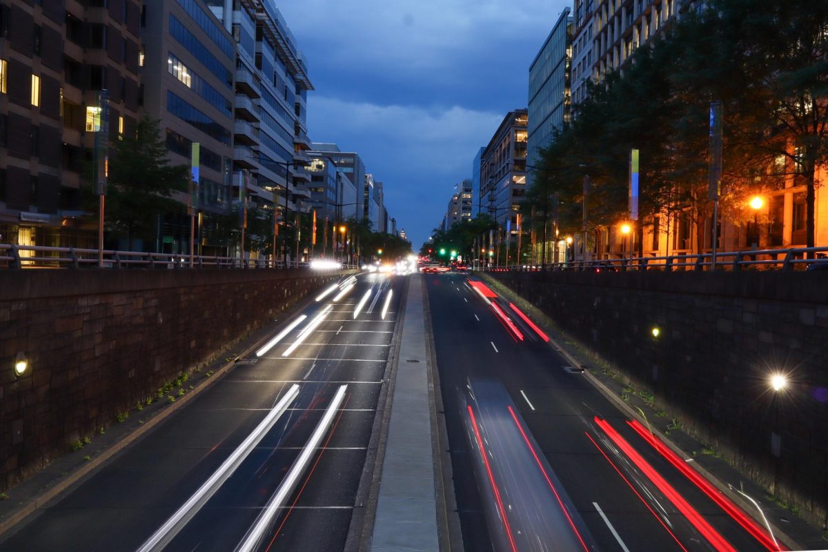 Vehicles drive down K Street.