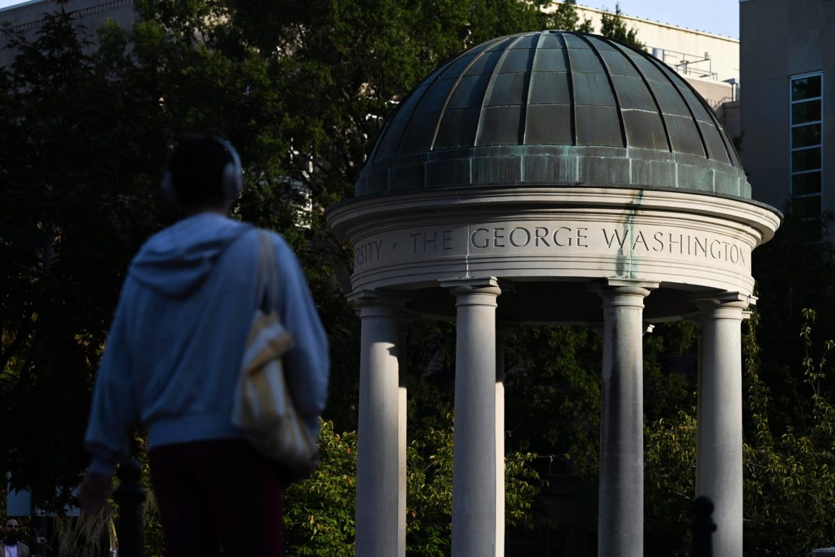 A student walks past the tempietto in Kogan Plaza. 