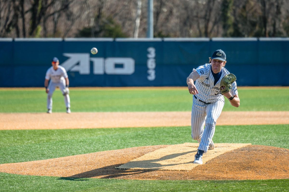 Senior Max Haug pitches during a game against St. Peter's University in February.