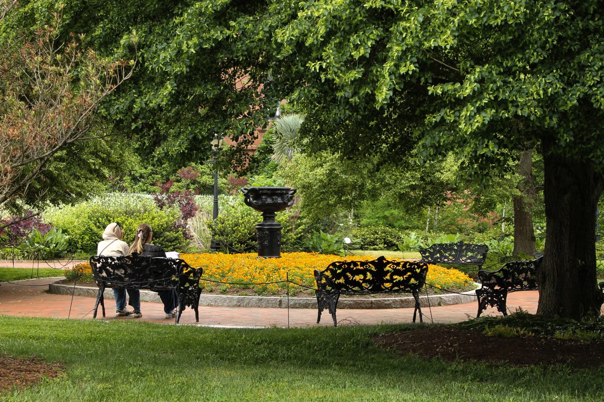 Visitors relax on a bench in the Enid A. Haupt Garden on the National Mall.