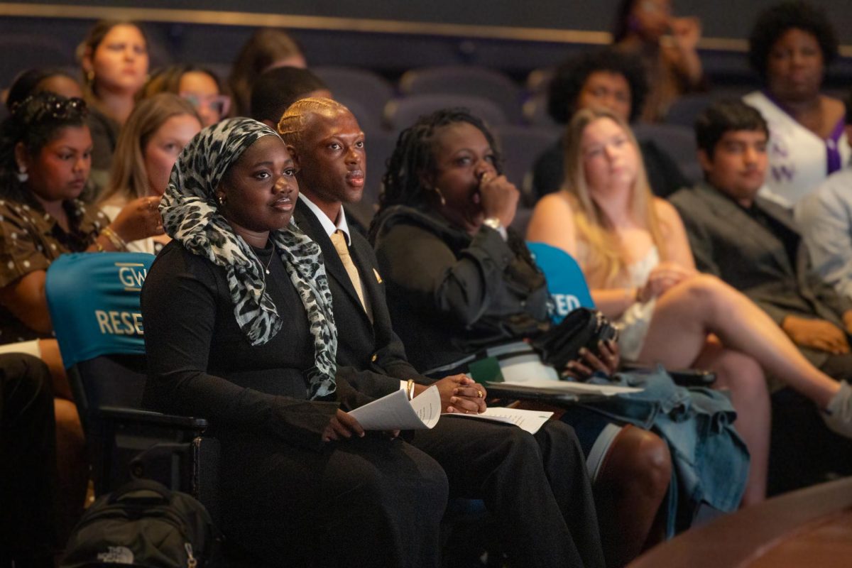 Student Government Association President MJ Childs and Vice President Aicha Sy sit during the swearing-in ceremony.