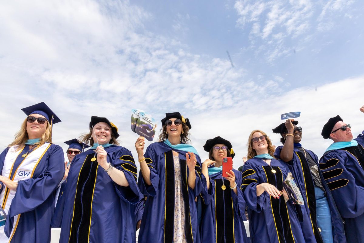 Students celebrate during University Commencement Sunday.