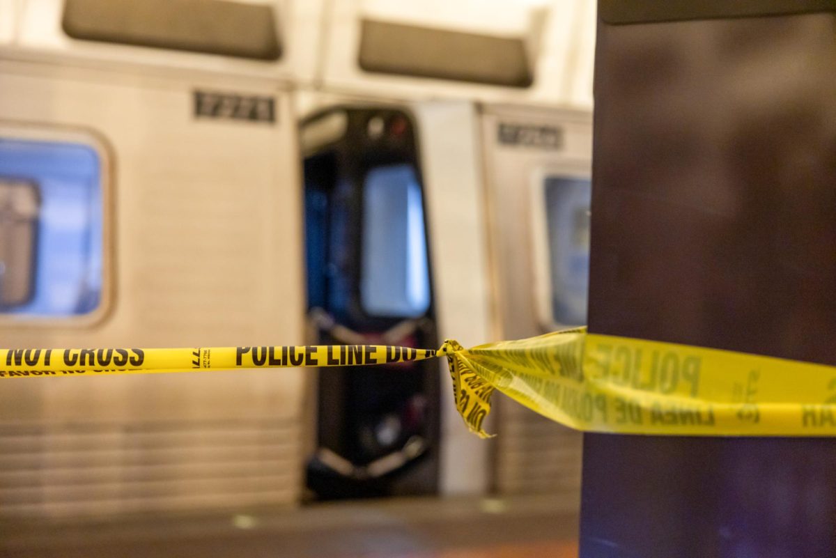 Police line tape blocks off the Virginia-bound platform at the Foggy Bottom metro station. 