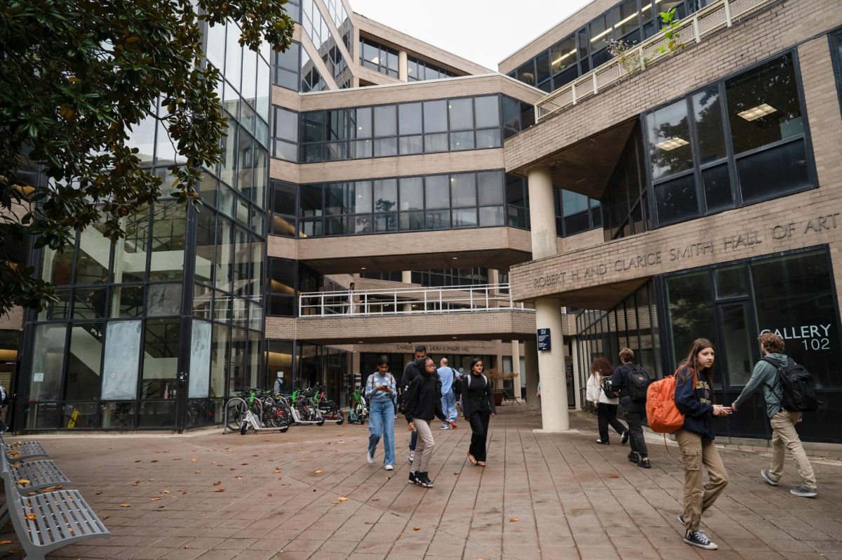 People walk through campus. 
