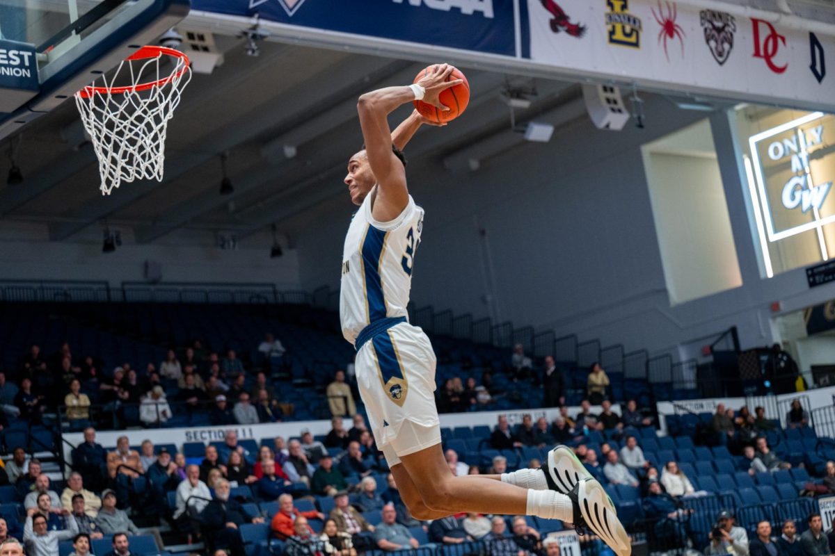 Former center Rafael Castro dunks during a game against Delaware in December.