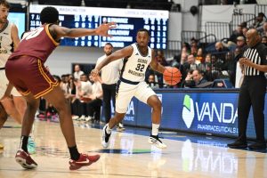 GW guard Amir Arrington plays during a game in January.